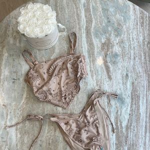 NWT Bikini is tan color with sun moon stars and shells! ASOS design brand